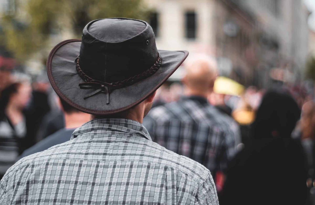 Man wearing leather hat 