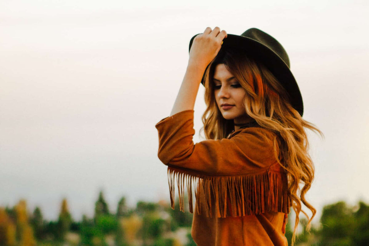 woman tipping her cowboy hat for women