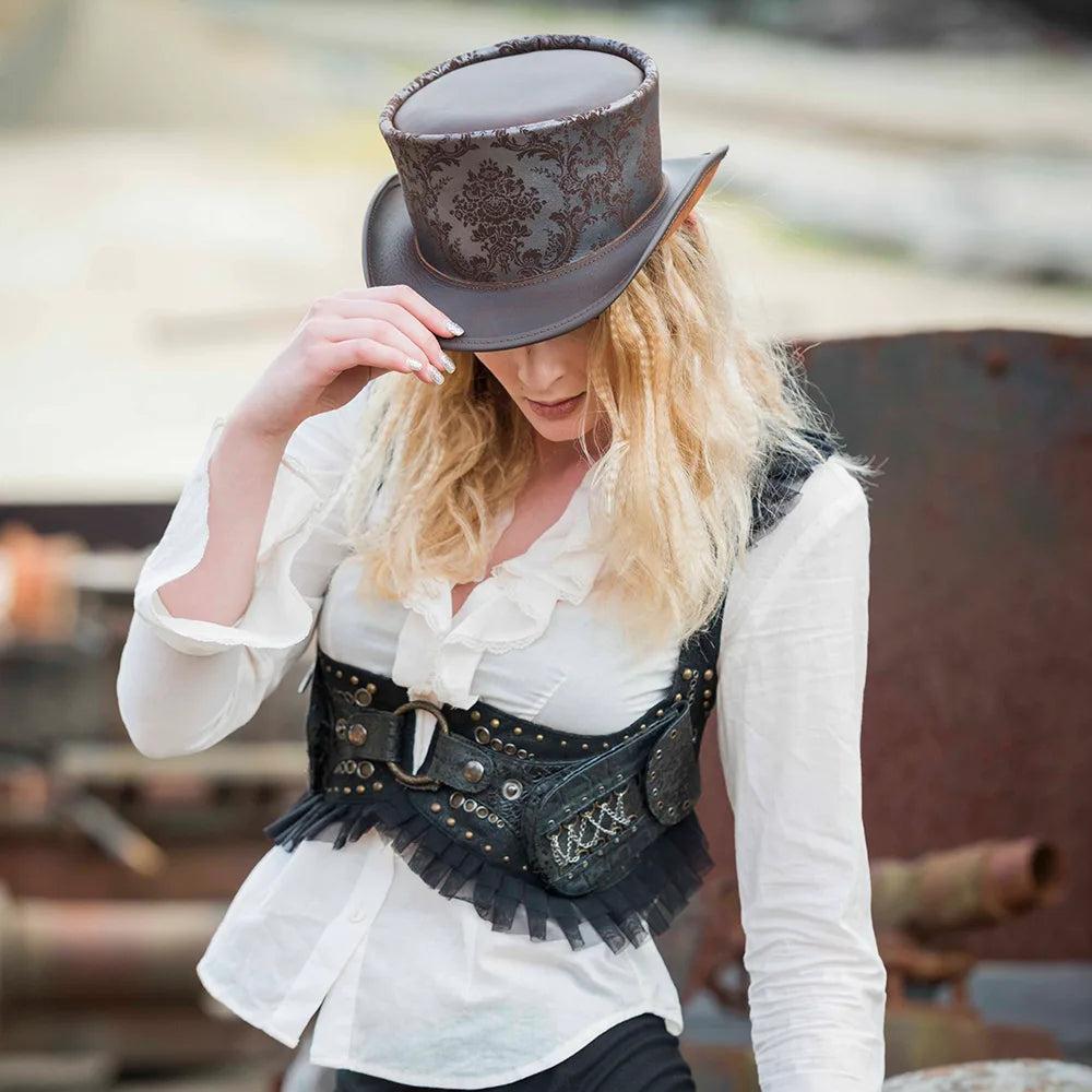 Person wearing a steampunk-style outfit with a top hat and decorative vest.