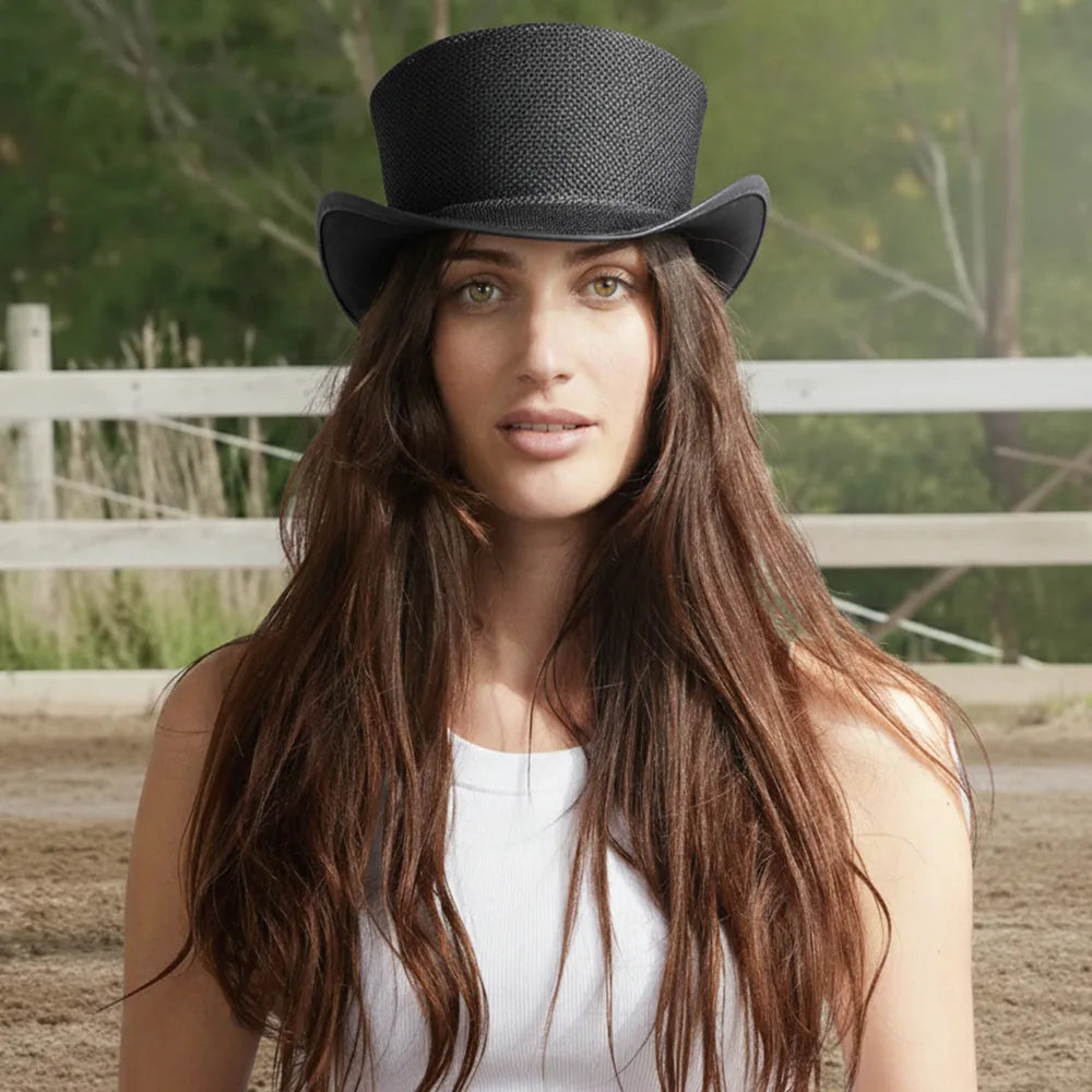 Woman wearing a black top hat with a blurred natural background