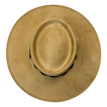 A top-down view of a light tan suede cowboy hat on a solid white background.