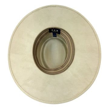 A top-down view of a light beige wide-brimmed hat, showing the inner crown with a striped band and a small black label with three white stars.