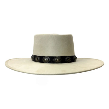 A light beige wide-brimmed cowboy hat with a black band decorated with silver conchos, shown against a plain white background.