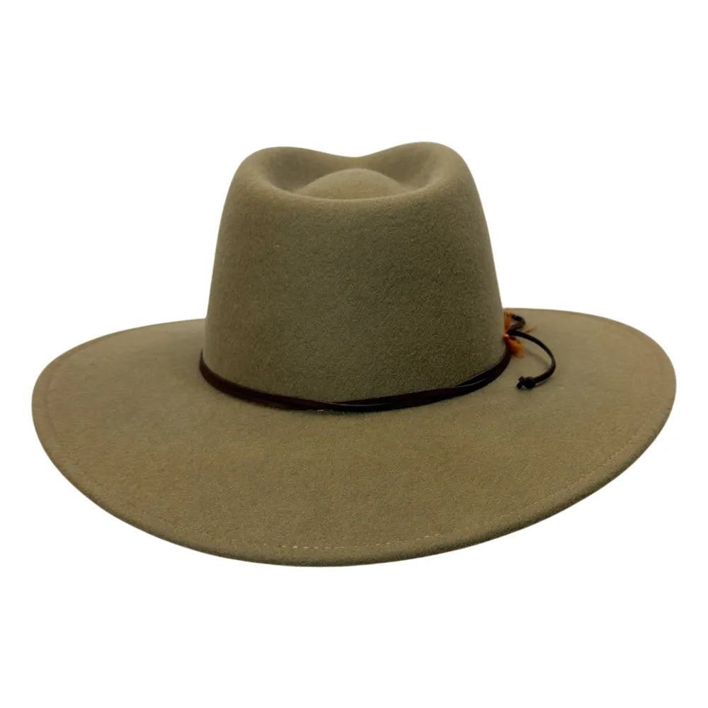 A wide-brimmed felt cowboy hat in a muted khaki-tan color, featuring a dark band around the crown and a small orange-brown decorative accent, shown against a plain white background.