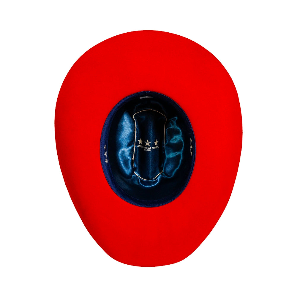 Red cowboy hat with blue interior on a white background