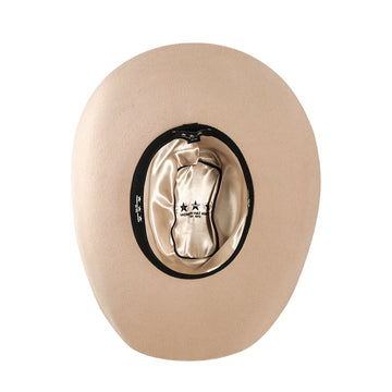 Beige cowboy hat with a black band on a white background