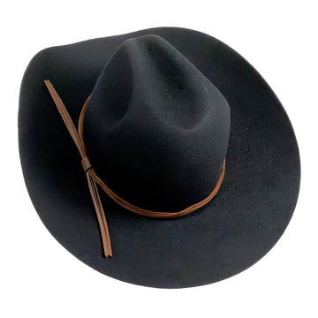 A black felt cowboy hat with a brown leather band and matching tie, shown from a top-down view on a white background.