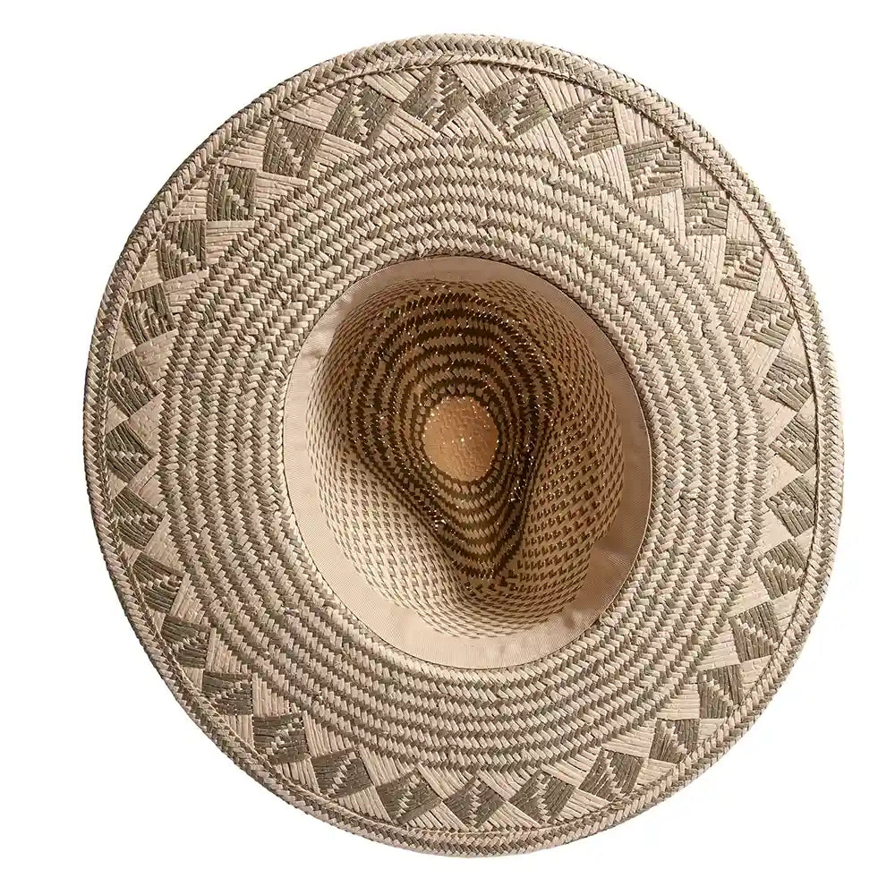 Woven straw hat with geometric pattern on a white background