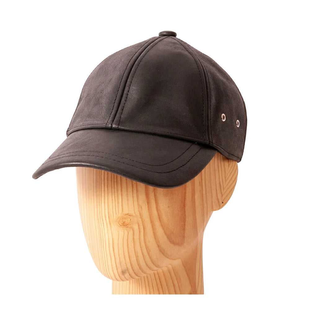 Brown baseball cap on a wooden mannequin head against a white background