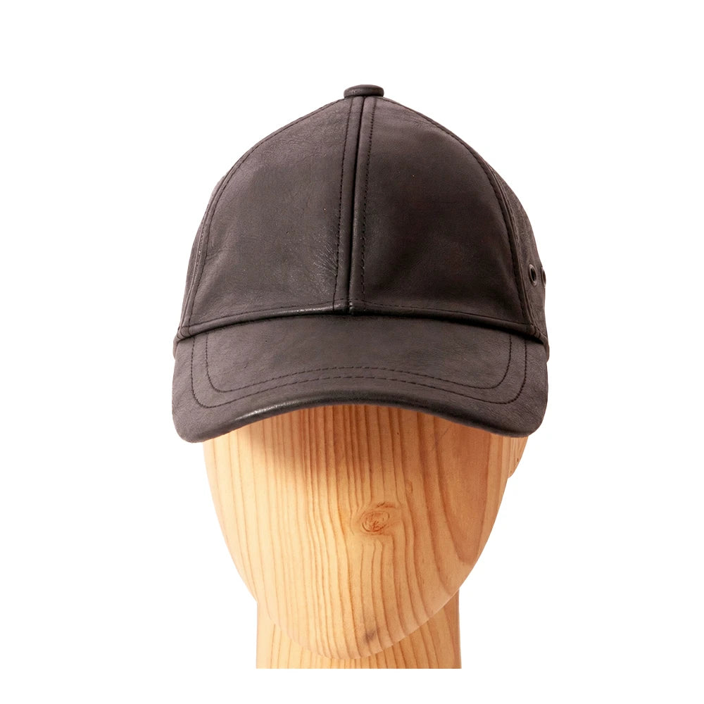 Brown baseball cap on a wooden mannequin head against a white background
